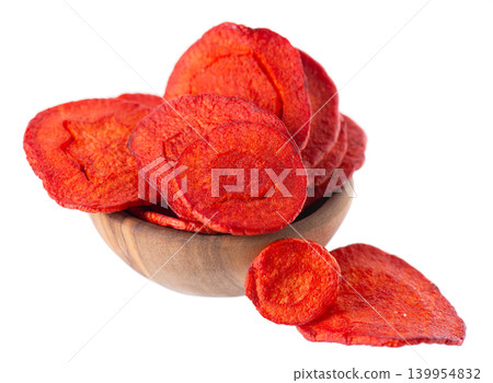 Crispy roasted carrot chips with sea salt, isolated on white background. Healthy and crunchy natural vegetable snack. Clipping path. Crispy roasted carrot chips with sea salt, isolated on white background. Healthy and crunchy natural vegetable snack. Clipping path. 139954832