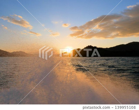 Crossing the Seto Inland Sea at sunset, off the coast of Mihara, Hiroshima Prefecture Crossing the Seto Inland Sea at sunset, off the coast of Mihara, Hiroshima Prefecture 139955108