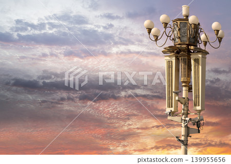 Street lamp on Tiananmen Square in Beijing, China (against the sunset), with propaganda or public announcement speakers     139955656
