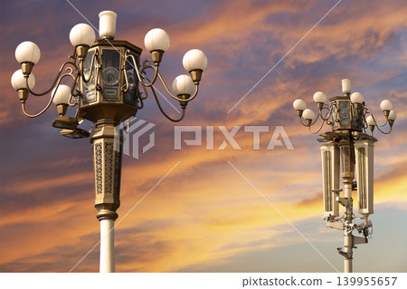 Street lamp on Tiananmen Square in Beijing, China (against the sunset), with propaganda or public announcement speakers     139955657