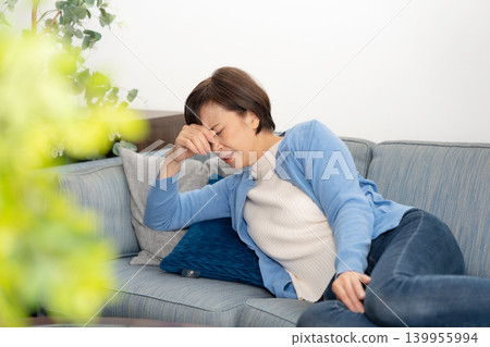 Senior women experience fatigue. 139955994
