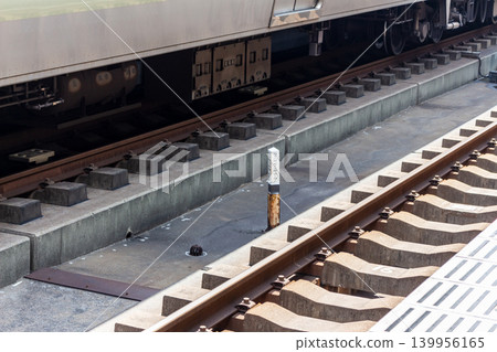 Modern railway track structure and undercarriage equipment of parked trains Modern railway track structure and undercarriage equipment of parked trains 139956165