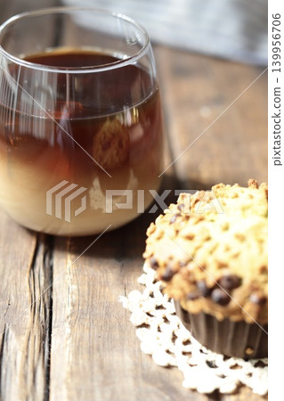 Crispy and fluffy matcha chocolate chip muffin and separate café au lait Crispy and fluffy matcha chocolate chip muffin and separate café au lait 139956706
