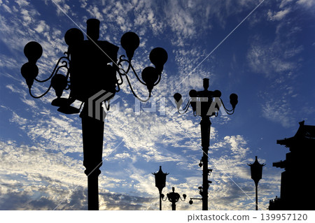 Street lamp on Tiananmen Square in Beijing, China (against the background of a beautiful sky with clouds), with propaganda or public announcement speakers 139957120