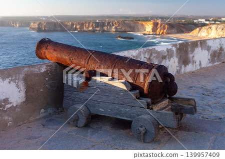 Abandoned Coastal Artillery at Sea Fortress During Sunset Light Abandoned Coastal Artillery at Sea Fortress During Sunset Light 139957409