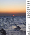The African sun setting over the sea 139957436