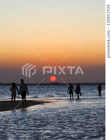 The African sun setting over the sea The African sun setting over the sea 139957438