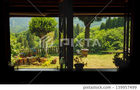 View of fresh greenery from the window View of fresh greenery from the window 139957499