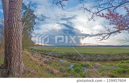 Storm clouds above rural meadow in Hessen Germany Storm clouds above rural meadow in Hessen Germany 139957604