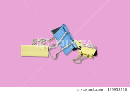 Colored stationery clips, binders. 139958216
