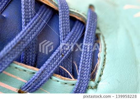 A blue shoelace on the boot. A blue shoelace on the boot. 139958228