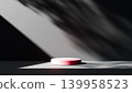 A background featuring a stage with sunlight streaming in against a black wall. 139958523
