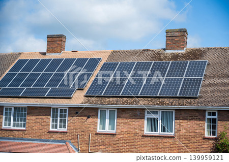 Residential houses with rooftop solar panels, renewable energy for sustainable homes Residential houses with rooftop solar panels, renewable energy for sustainable homes 139959121