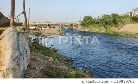Untreated sewage wastewater flowing through Lyari River Karachi Pakistan highlighting urban pollution and environmental damage Untreated sewage wastewater flowing through Lyari River Karachi Pakistan highlighting urban pollution and environmental damage 139959762