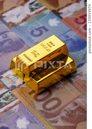 Canadian gold bars or ingots as a tool for balance, financial investment. Canadian gold Canadian gold bars or ingots as a tool for balance, financial investment. Canadian gold 139959974