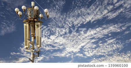 Street lamp on Tiananmen Square in Beijing, China (against the background of a beautiful sky with clouds), with propaganda or public announcement speakers 139960100