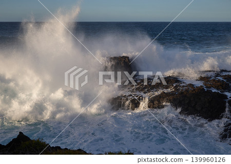Powerful Ocean Waves Crashing on Rocky Coast 139960126