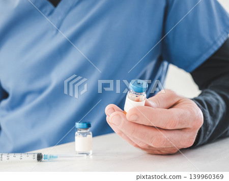 Healthcare worker in a blue medical scrubs Healthcare worker in a blue medical scrubs 139960369