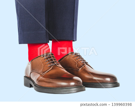 Man in black pants and bright red socks Man in black pants and bright red socks 139960398