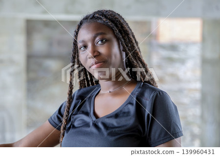 Confident young African woman portrait outdoors, lifestyle headshot Confident young African woman portrait outdoors, lifestyle headshot 139960431