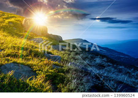 mountain landscape on summer solstice. day meet night. beautiful outdoor scenery of carpathian mountains. sun and moon over grassy slopes with rocks. astrology image for ukraine travel concept mountain landscape on summer solstice. day meet night. beautiful outdoor scenery of carpathian mountains. sun and moon over grassy slopes with rocks. astrology image for ukraine travel concept 139960524