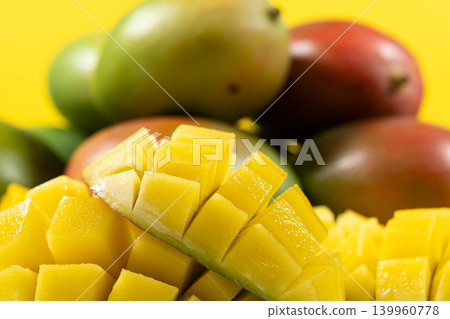 Juicy mango halves with cube cut pattern. Juicy mango halves with cube cut pattern. 139960778