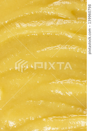 Close-up of creamy mashed apple sauce texture. Close-up of creamy mashed apple sauce texture. 139960798