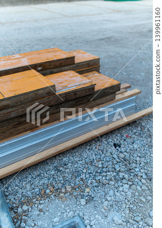 Photographs of lumber and formwork materials piled up at a construction site. Photographs of lumber and formwork materials piled up at a construction site. 139961160