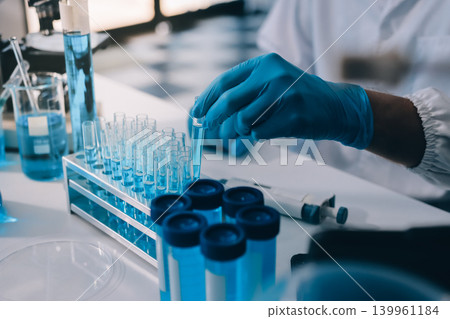 Lab technician experimenting in lab Lab technician experimenting in lab 139961184
