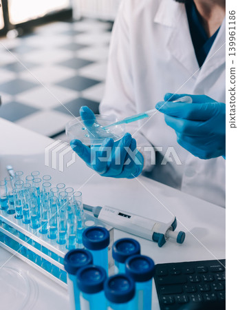 Lab technician experimenting in lab Lab technician experimenting in lab 139961186