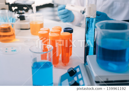 Lab technician experimenting in lab Lab technician experimenting in lab 139961192