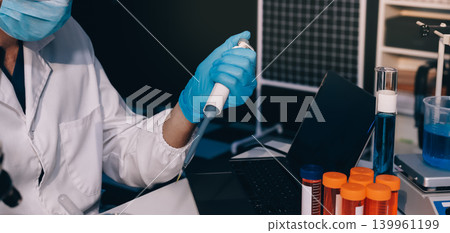 Lab technician experimenting in lab Lab technician experimenting in lab 139961199