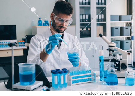 Lab technician experimenting in lab Lab technician experimenting in lab 139961629