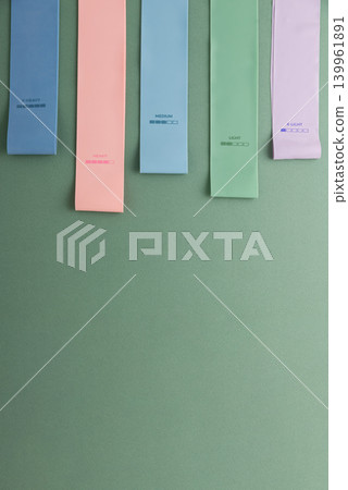 Colorful resistance bands displaying resistance levels for fitness Colorful resistance bands displaying resistance levels for fitness 139961891