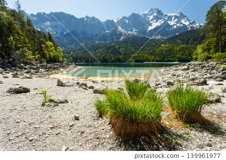 Travel landscape of Eibsee lake and Zugspitze Alps in Bavaria Germany, scenic summer nature panorama with forest, snow mountains peak Travel landscape of Eibsee lake and Zugspitze Alps in Bavaria Germany, scenic summer nature panorama with forest, snow mountains peak 139961977