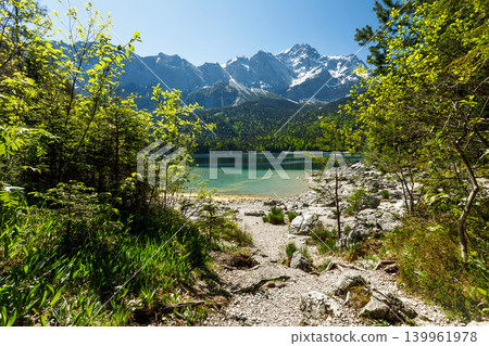 Travel landscape of Eibsee lake and Zugspitze Alps in Bavaria Germany, scenic summer nature panorama with forest, snow mountains peak 139961978