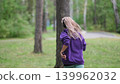 Portrait of young sportswoman jogging during outdoor training in park in the morning. Sport and healthy lifestyle concept 139962032