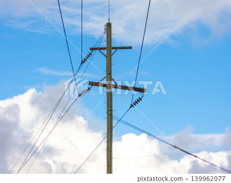 Wooden telephone poles against a vibrant blue sky in the Blue Mountains Wooden telephone poles against a vibrant blue sky in the Blue Mountains 139962077