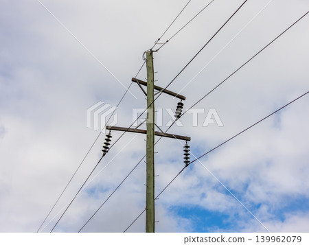 Wooden telephone poles against a vibrant blue sky in the Blue Mountains Wooden telephone poles against a vibrant blue sky in the Blue Mountains 139962079