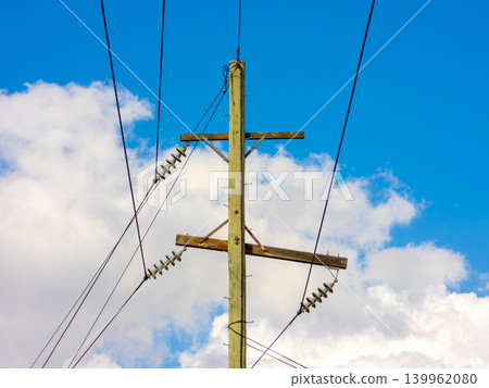 Wooden telephone poles against a vibrant blue sky in the Blue Mountains Wooden telephone poles against a vibrant blue sky in the Blue Mountains 139962080