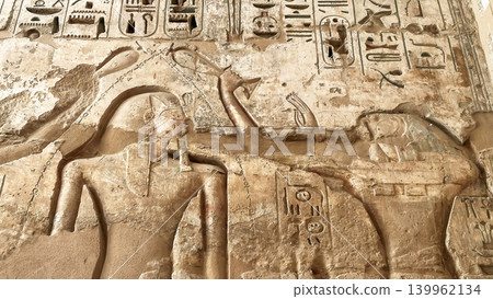 Beautiful bas-reliefs and ancient hieroglyphs from the mortuary temple of Ramesses III at Medinet Habu, Luxor, Egypt. Beautiful bas-reliefs and ancient hieroglyphs from the mortuary temple of Ramesses III at Medinet Habu, Luxor, Egypt. 139962134