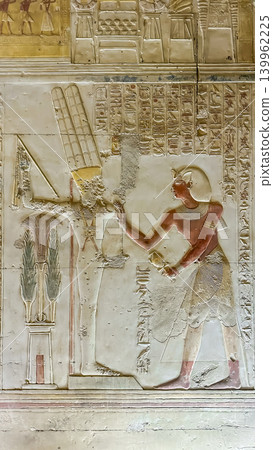 Beautiful bas-reliefs and ancient hieroglyphs in the Temple of Seti I in Abydos, Egypt. Beautiful bas-reliefs and ancient hieroglyphs in the Temple of Seti I in Abydos, Egypt. 139962225