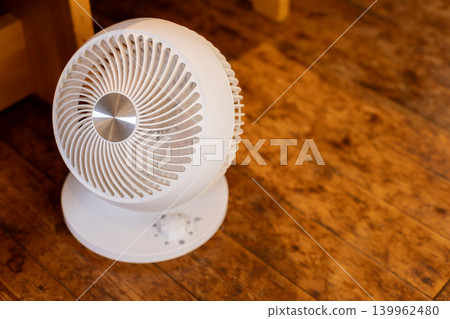 A stylish front view of a white circulator. A stylish front view of a white circulator. 139962480