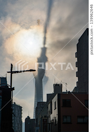 The Tokyo Skytree appears bent and distorted, shrouded in fog. The Tokyo Skytree appears bent and distorted, shrouded in fog. 139962646