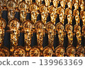 Many golden Buddha statues lined up 139963369