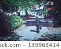 A businessman walking in a park (from behind) 139963414