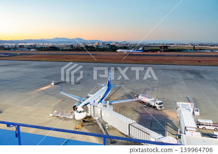 Sendai Airport, twilight time, magic hour, runway bathed in royal blue light, sunset. 139964706