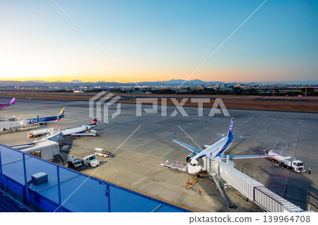 Sendai Airport, twilight time, magic hour, runway bathed in royal blue light, sunset. 139964708