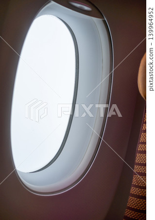 View of an window from the interior of airplan, with an empty view View of an window from the interior of airplan, with an empty view 139964952