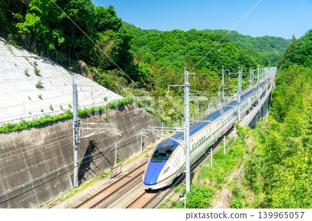 The Hokuriku Shinkansen runs through Annaka City in spring. 139965057